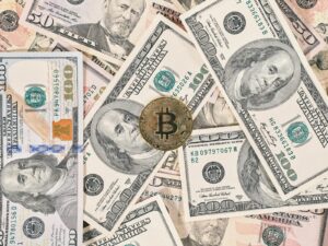 Bitcoin on American dollar banknote close up